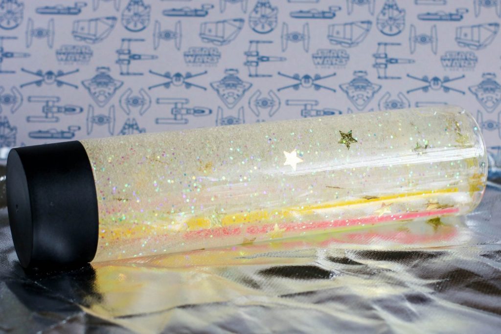 sensory bottle with glitters and stars